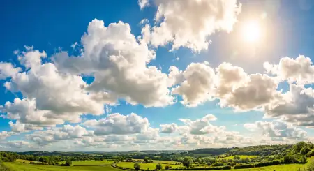 dreamy summer background with clouds and sunshine